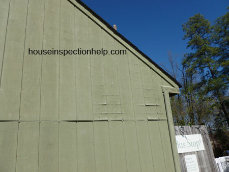 green t1-11 plywood siding with water damage