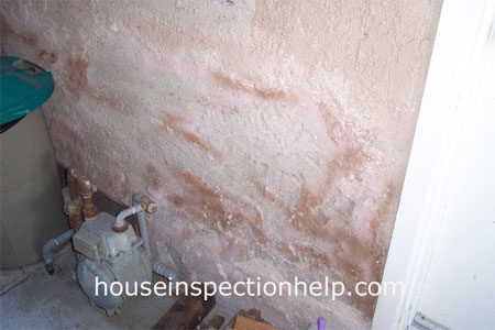 badly damaged stucco wall from water damage