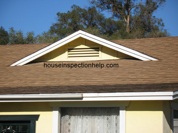 light colored composition roof shingles on house